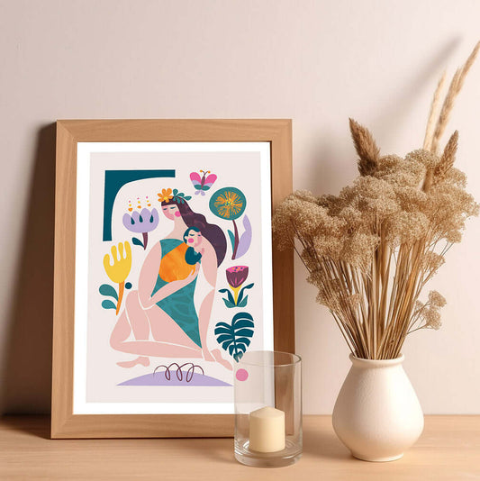 A framed art print featuring a woman is holding a baby and surrounded by vibrant flowers.