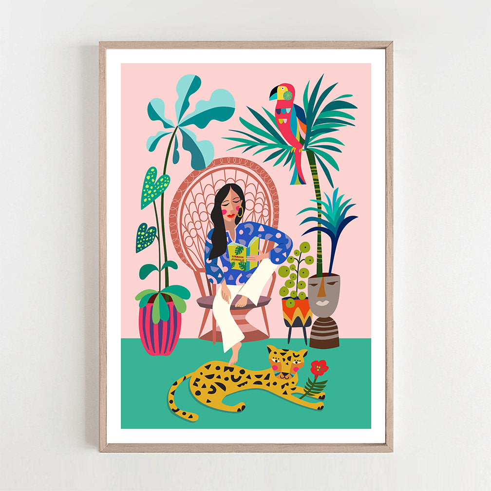 The Print featuring a Woman is reading a book on a chair and leopard chilling on the floor.