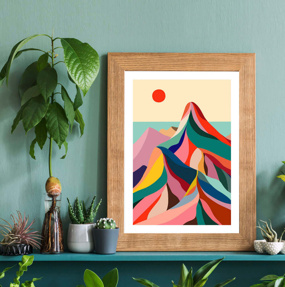 A framed art print showcasing a majestic mountain range, capturing the beauty and grandeur of nature.