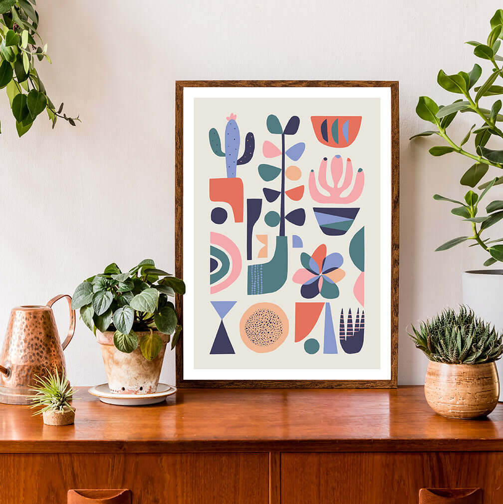 Colorful succulents and flowers art print in frame.