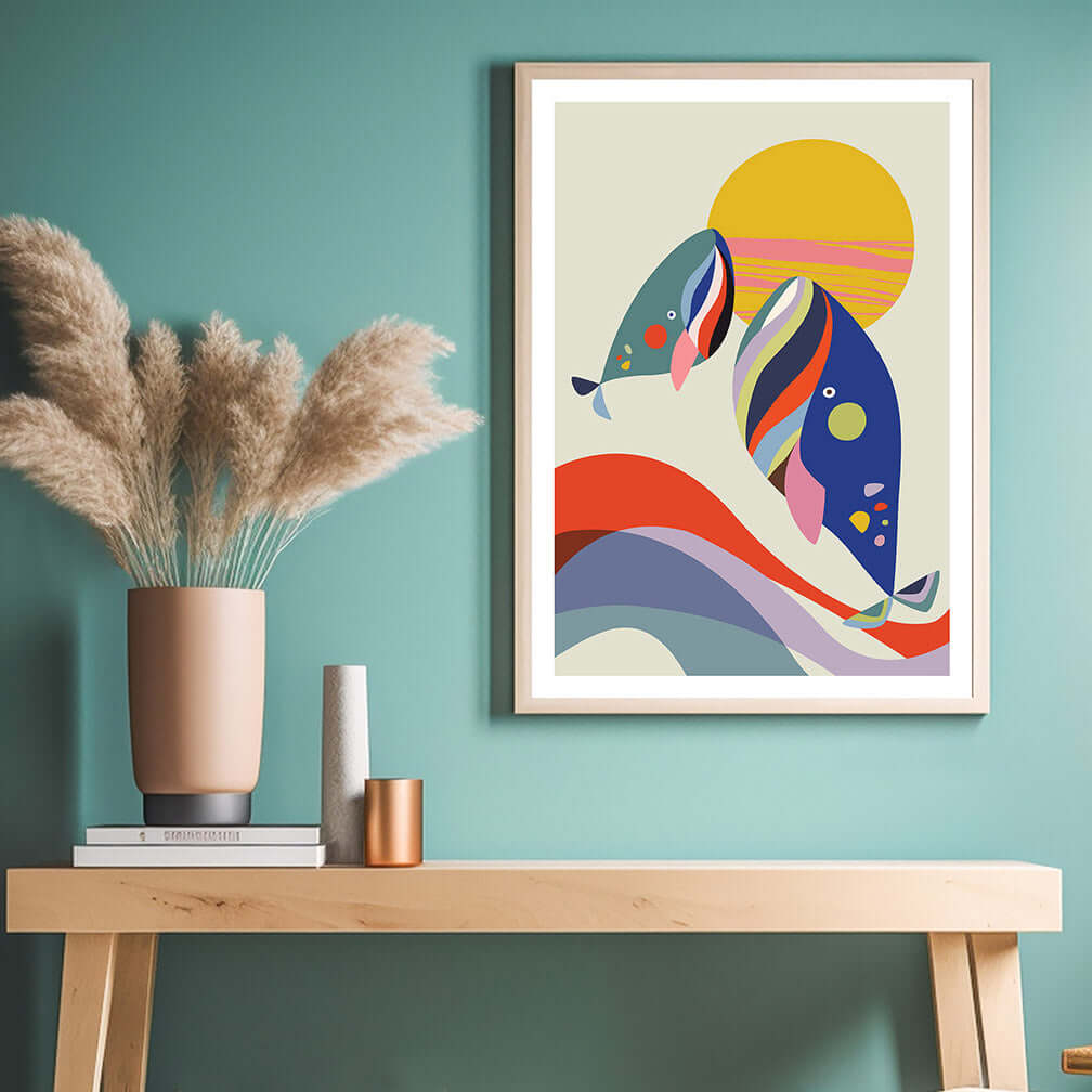 Colorful whales and sun abstract art print set against a sea background.