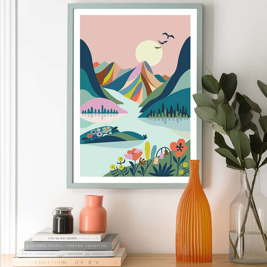 A vibrant mountain landscape print adorning a wall, showcasing the beauty of scenic mountains.