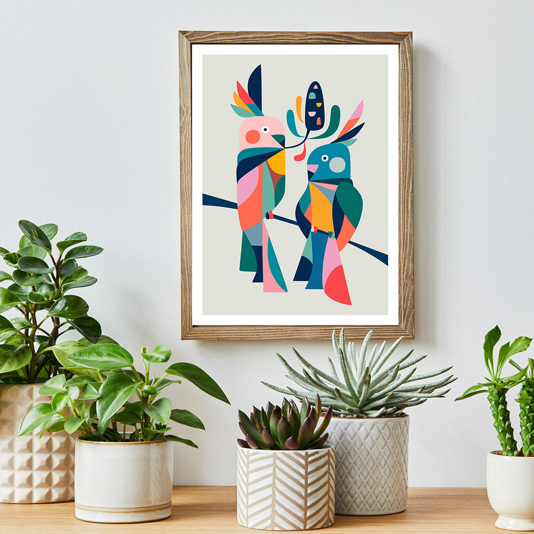 A vibrant bird print on a wooden frame, adding a pop of color to any space.