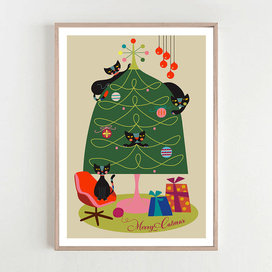 A festive framed print of a black cat perched on a Christmas tree.