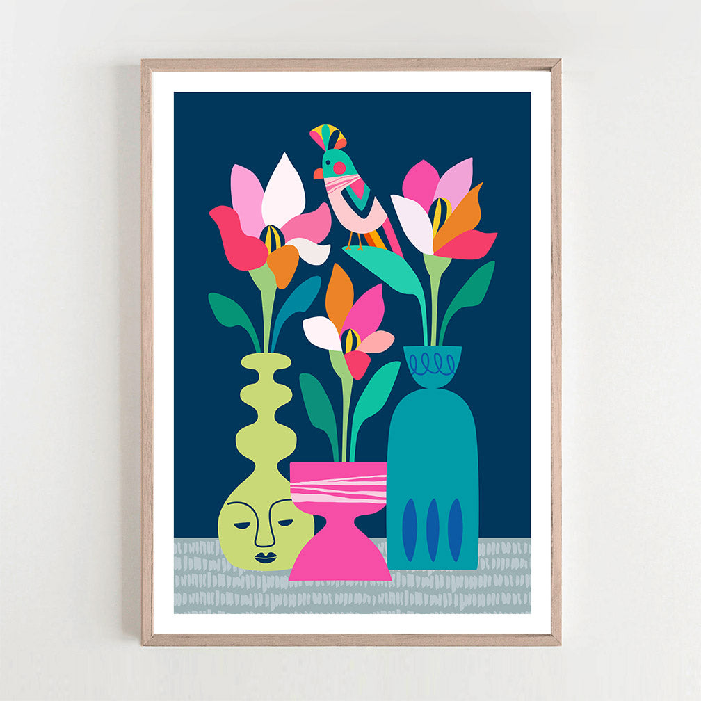 Colorful floral print with flowers in vase design hanging on wall.