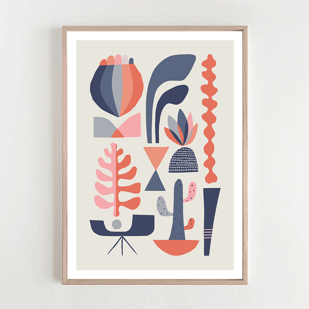 A framed abstract succulents art print hanging on the wall.