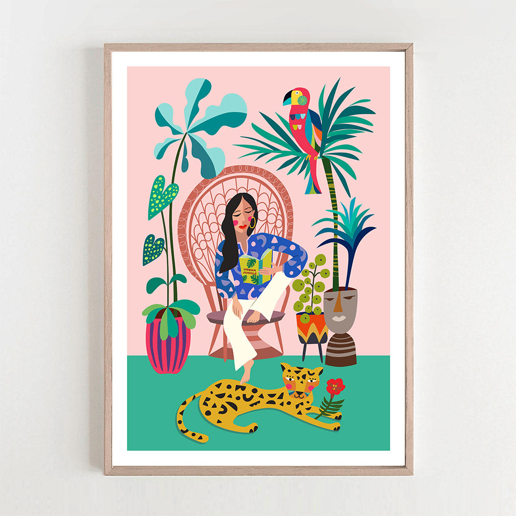The Print featuring a Woman is reading a book on a chair and leopard chilling on the floor. 