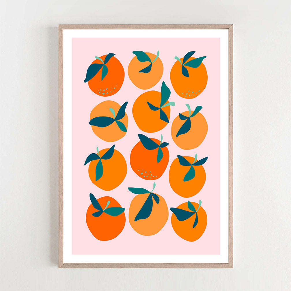 Colorful abstract art print featuring orange and pink hues hanging on a wall.