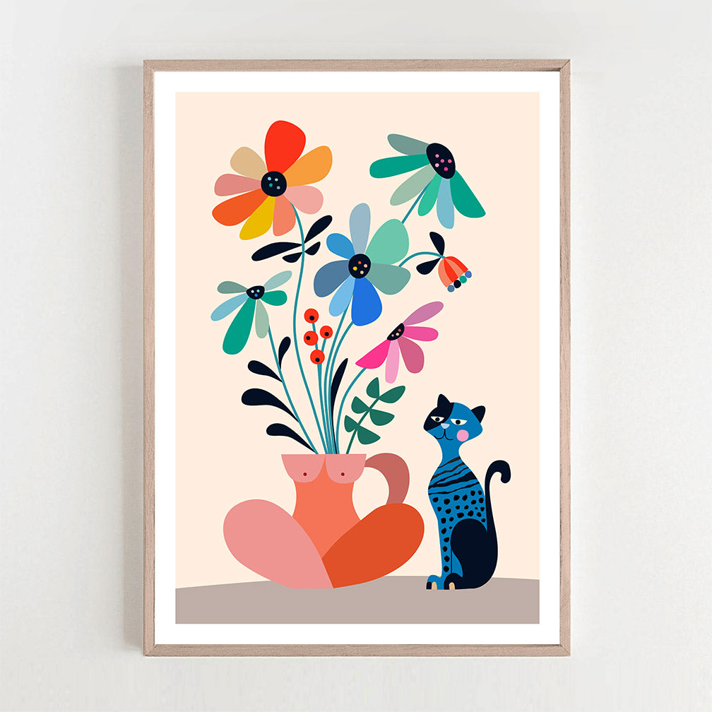 A framed art print featuring a cute cat surrounded by colorful Daisies..