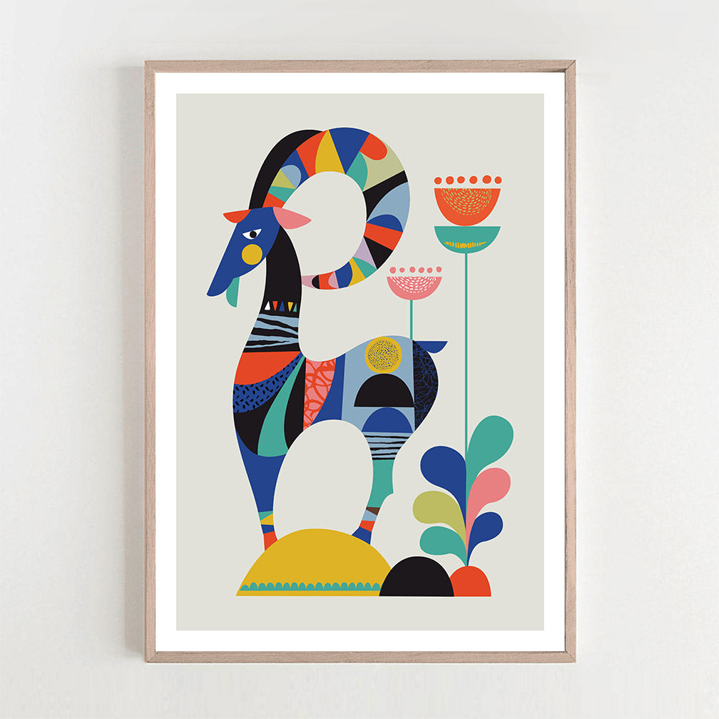 A vibrant abstract goat print on a white wall, adding a pop of color and creativity to the space.