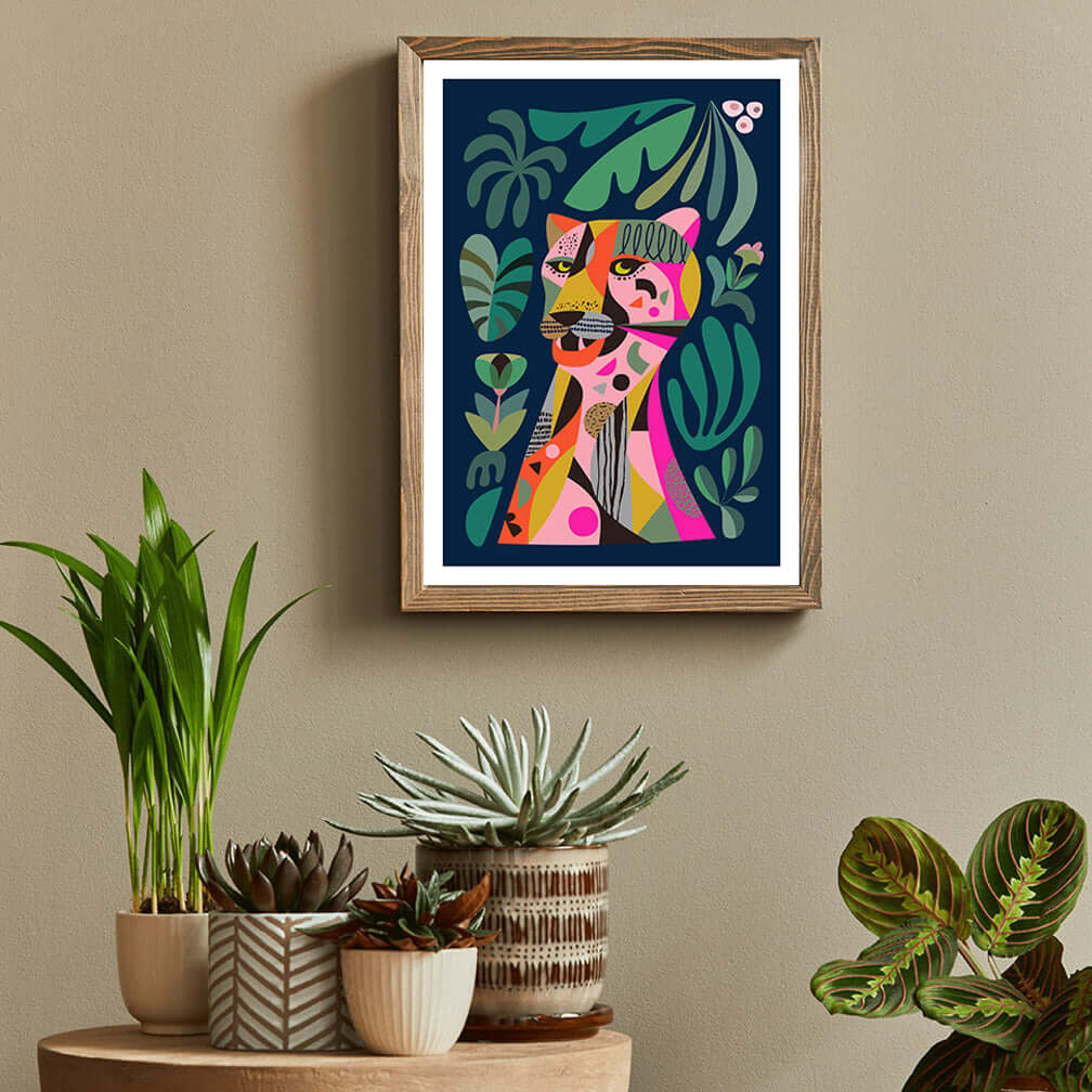 Vibrant leopard art print hanging on wall with the pot plants.