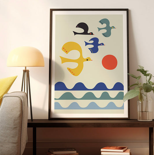 Sunset art print featuring a flock of birds flying over the ocean.