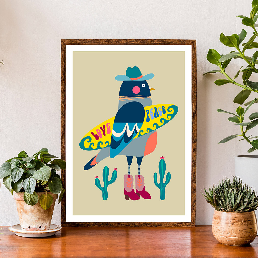 This pigeon is ready to catch some waves!  Who knew surfboards and cacti made such a perfect pair? 