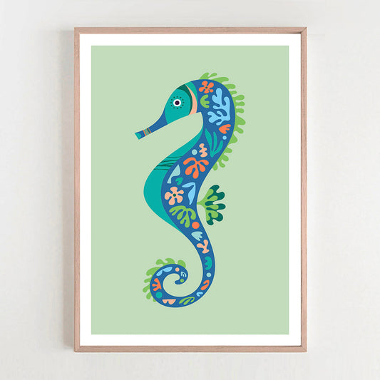 A vibrant seahorse art print in a stylish frame, hanging on a wall, adding a pop of color to the room.  