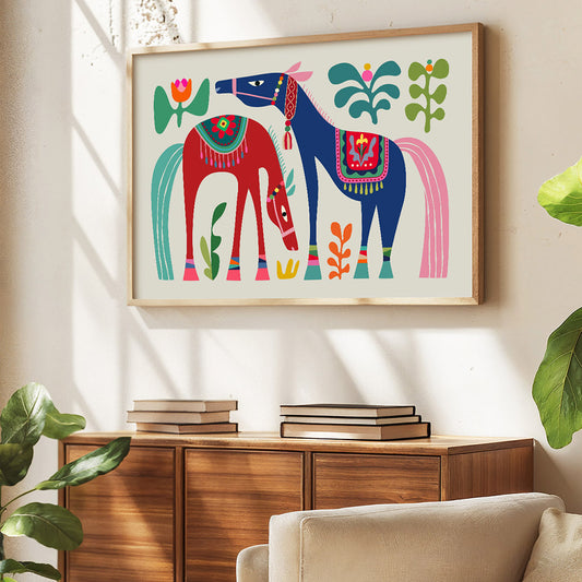 Colorful horse illustration in a wooden frame on a wall above a wooden cabinet.