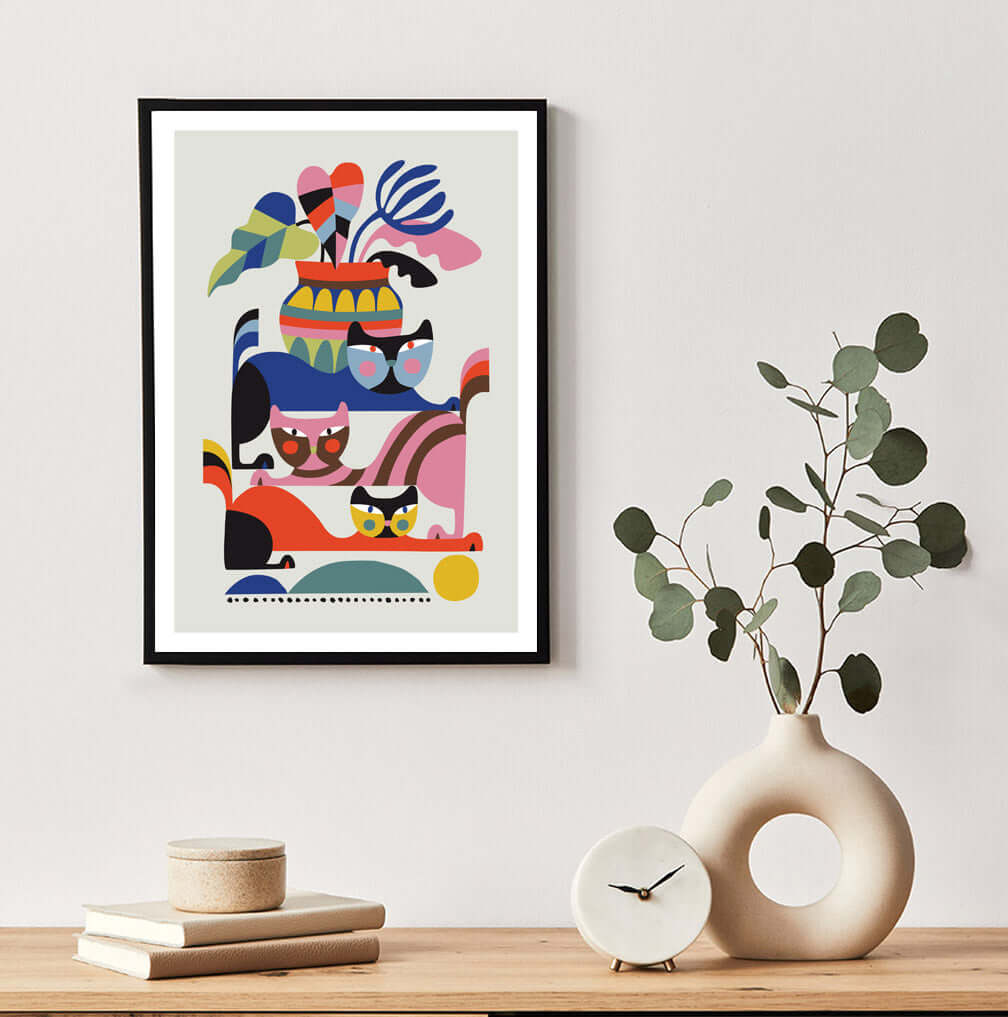 Vibrant cat-themed art print with colorful shapes.