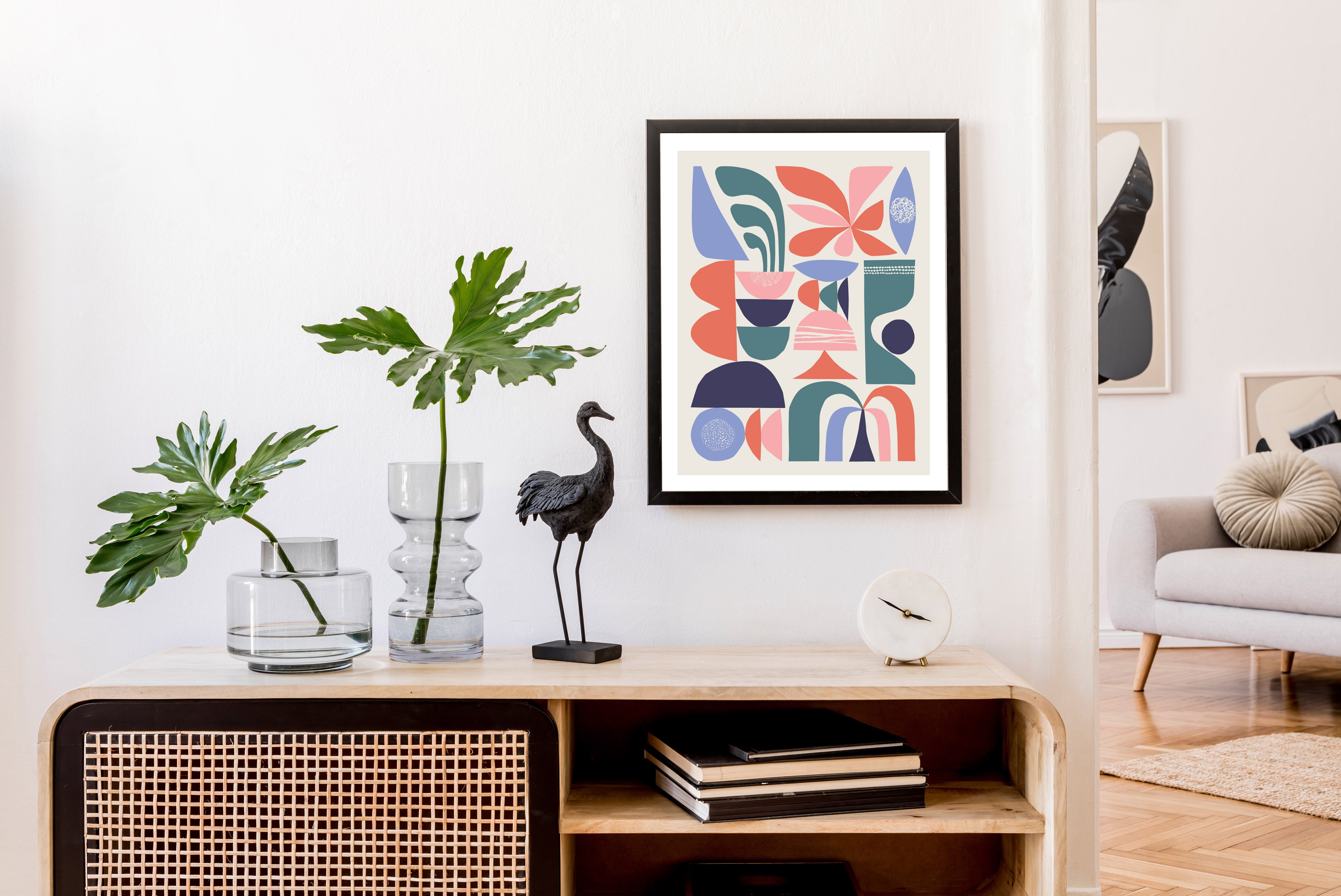 A contemporary living room featuring a wooden cabinet and a vibrant plant, Mid century wall art hanged on the wall and adding a touch of nature to the space.
