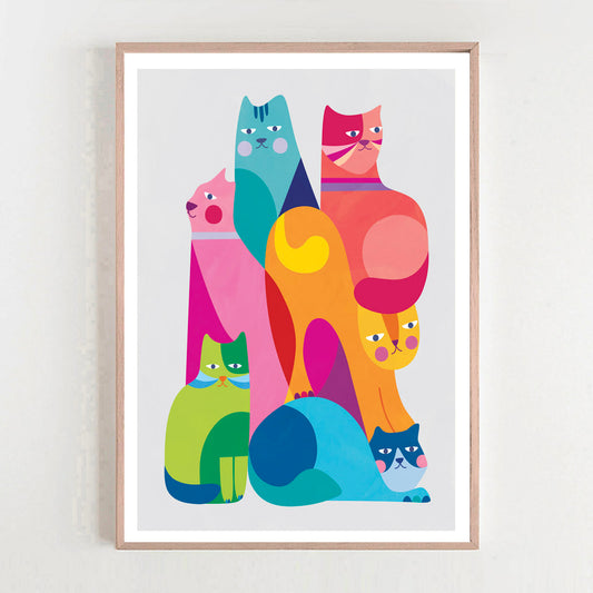 Framed colorful cat illustration on a white wall
