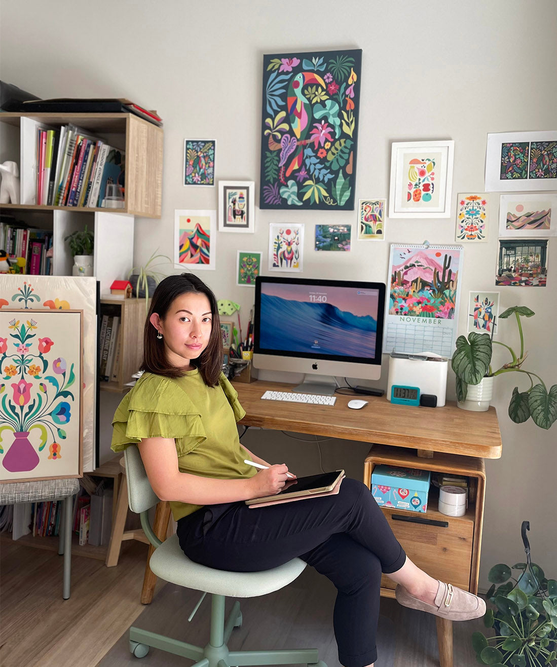 A woman focused on work, sitting at a desk, using a computer.